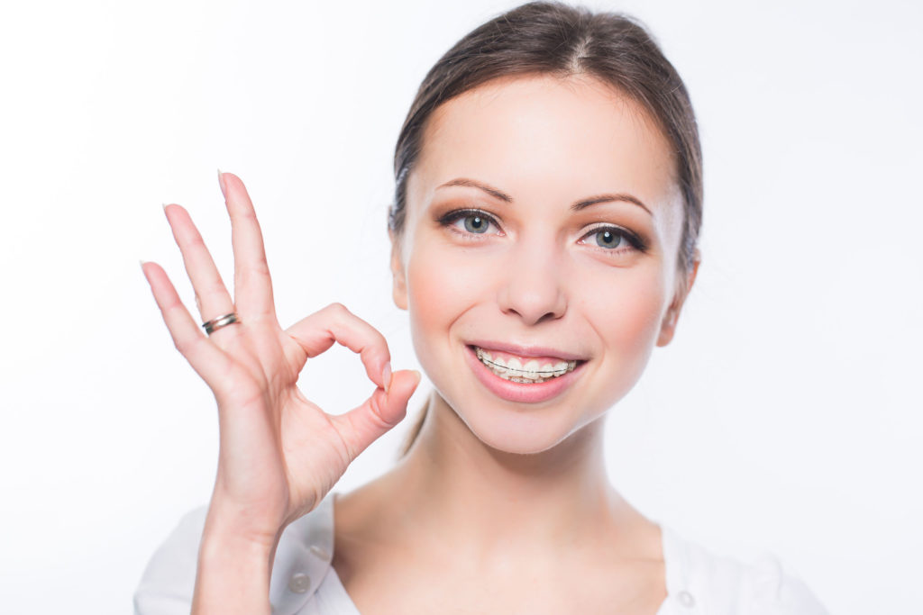 beautiful young woman with teeth braces